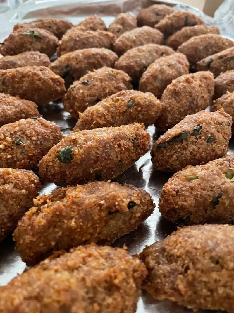 Torpedo-shaped kibbeh made with cracked wheat and beef